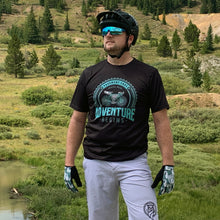 Load image into Gallery viewer, Man wearing Gravel Wear Jersey and shorts