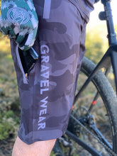 Load image into Gallery viewer, Gravel Ride Shorts Camo with bike computer in pocket
